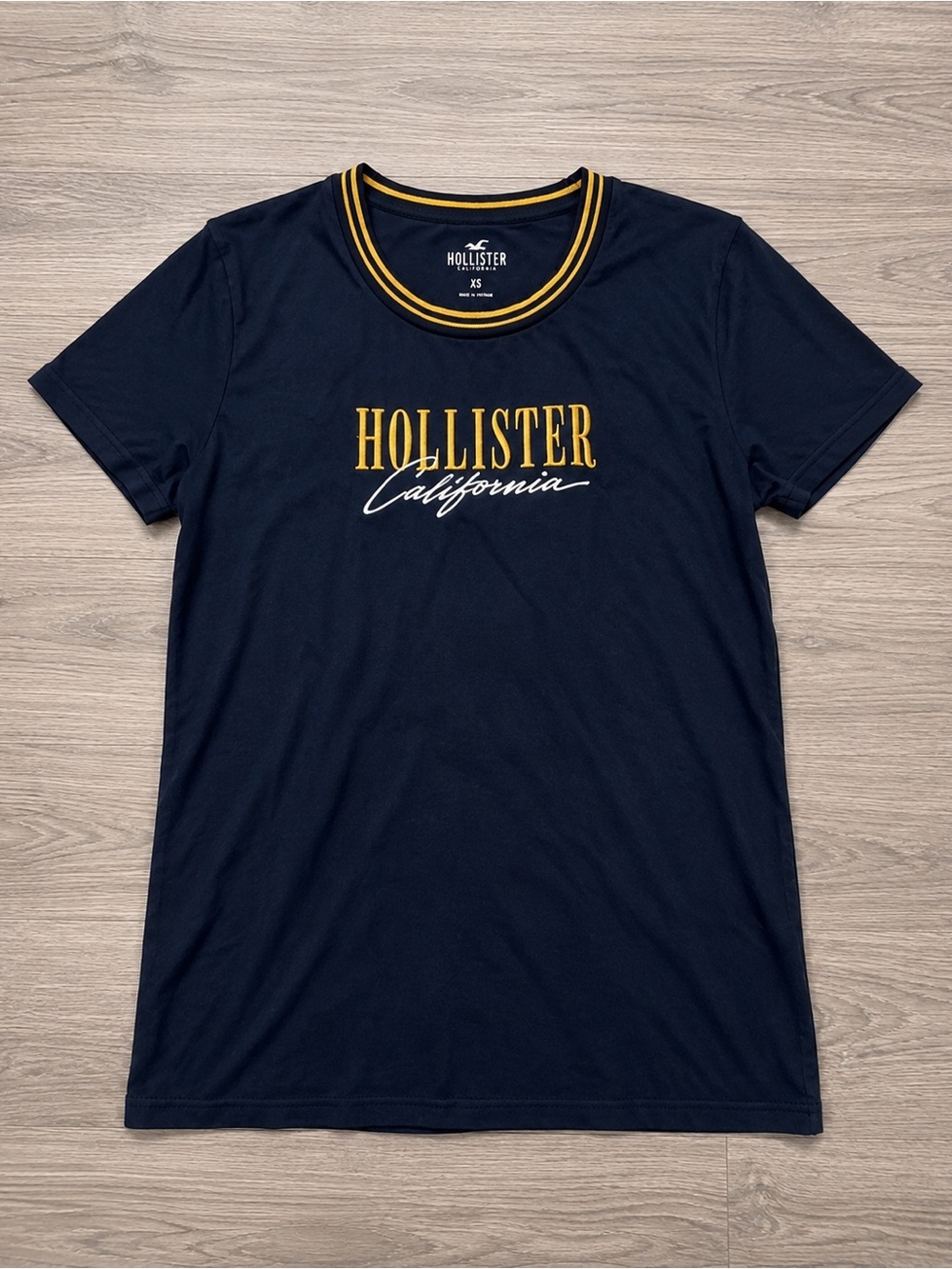 Hollister Navy Tee with Yellow Logo and Collar Trim
